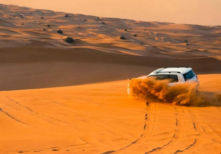 Dubai: Desert Safari, Camel Ride, Sandboard & Buffet Dinner - The 4x4 ride sets the tone