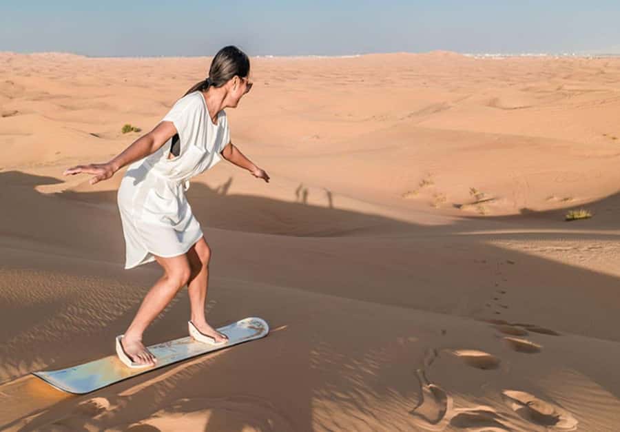 Dubai: Desert Safari Camel Riding, Sandboarding & BBQ Dinner - Pickup from Dubai and the long road to the dunes