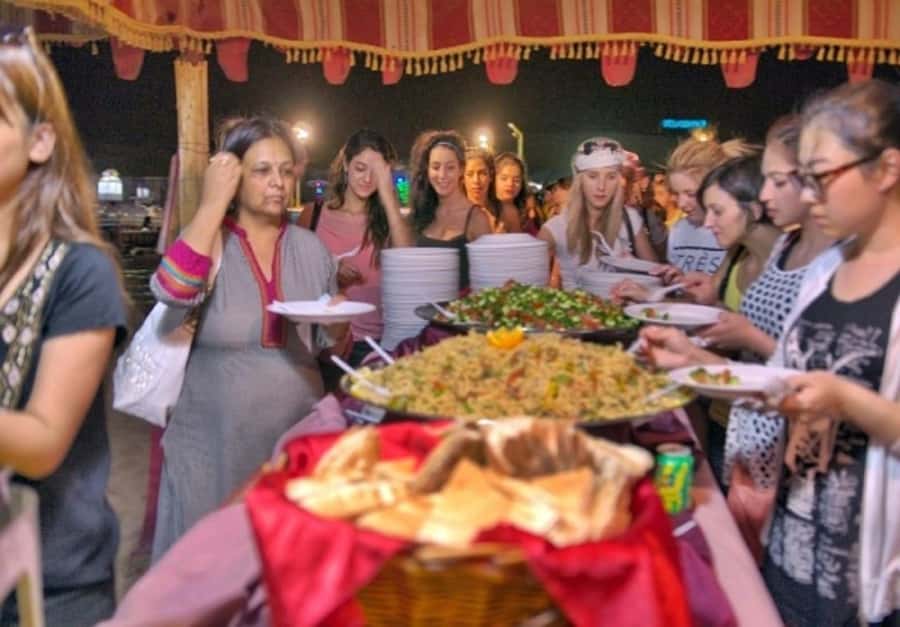 Dubai: Desert Safari Camel Riding, Sandboarding & BBQ Dinner - Sandboarding from the dunes