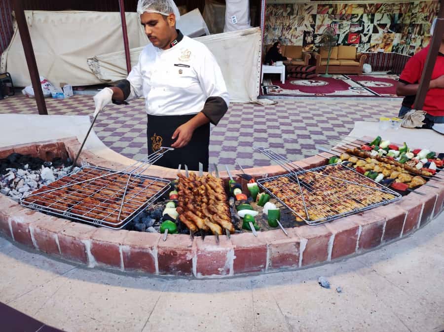 Dubai: Desert Safari Camel Riding, Sandboarding & BBQ Dinner - BBQ dinner and shows after dark